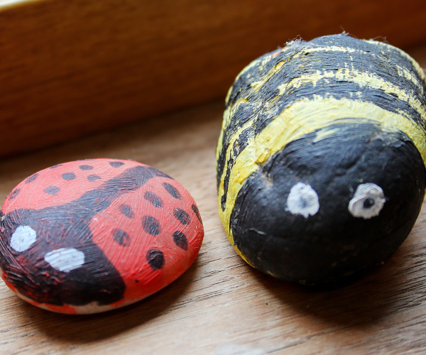 A couple of painted ladybirds made of stone